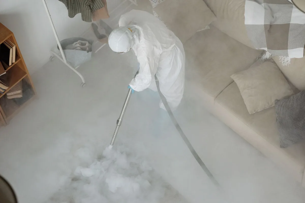 Biohazard cleanup technician in protective equipment, St. George, UT